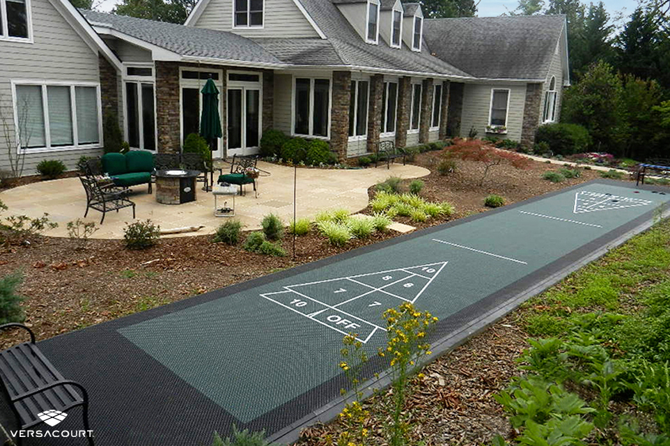 Shuffleboard court installed in a small backyard