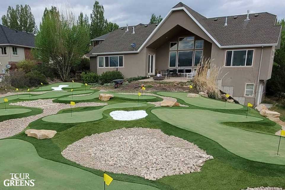 A large backyard converted into a putting green course