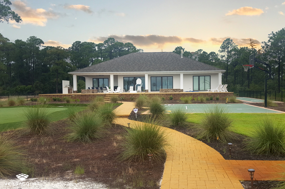 Oceanside home with a tour quality putting green in the backyard