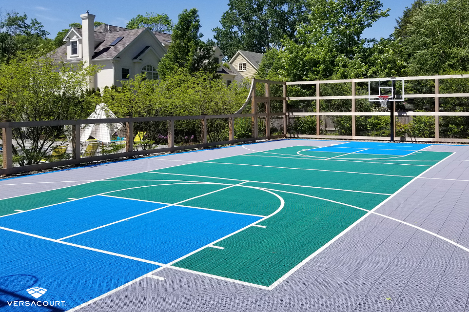 Large backyard designed with a VersaCourt multi-sport game court