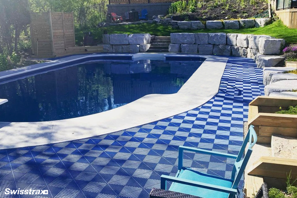 Pool deck with Swisstrax modular flooring tiles installed