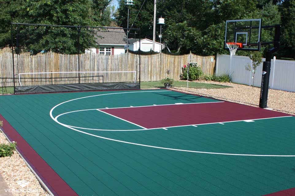 Backyard basketball court with a ball rebounder