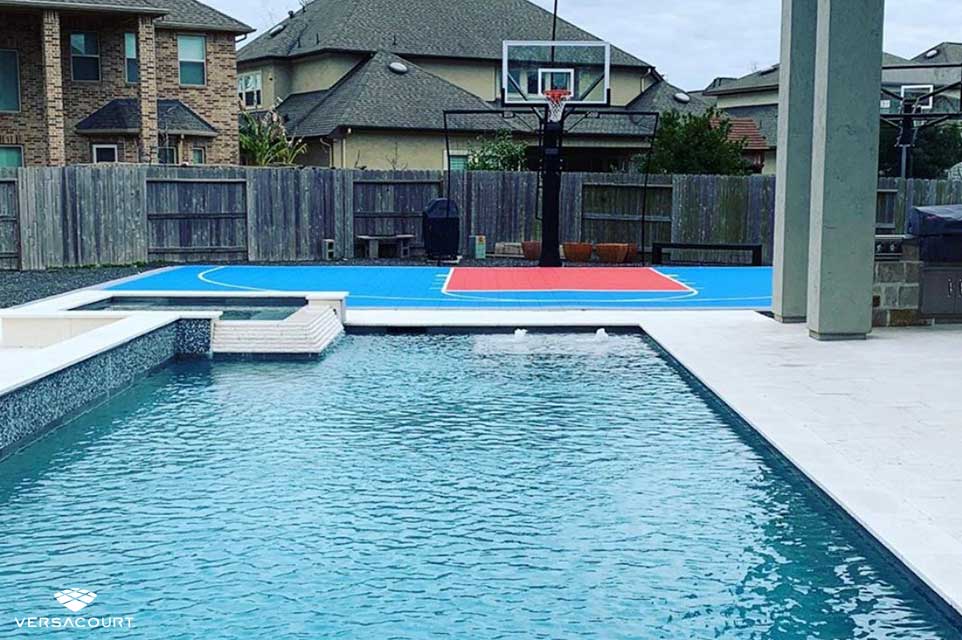 Backyard swimming pool with VersaCourt's multi-sport court