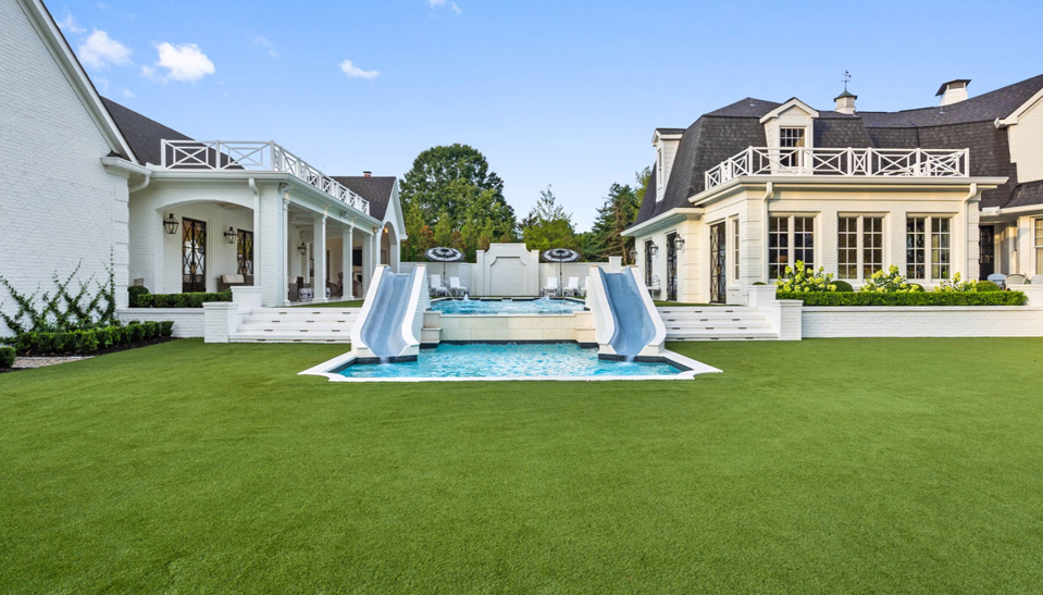 turf lawn with pool and double slide