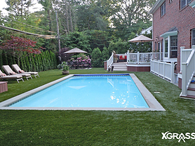 Swimming pool surrounded by artificial turf