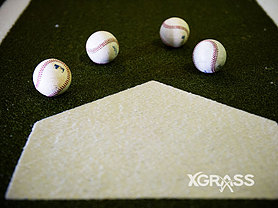 Baseballs next to home plate